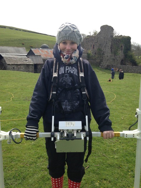 One of the first year students from UCLan undertaking a magnetometry survey. Still smiling despite the cold!